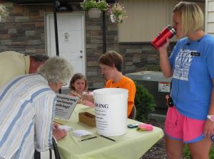 Customers signing up for our drawing at the welcome table.